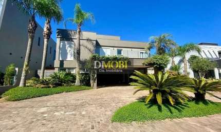 Sobrado com 3 dormitórios para alugar, 393 m² por R$ 25.428,52/mês - Alphaville - Gravataí/RS