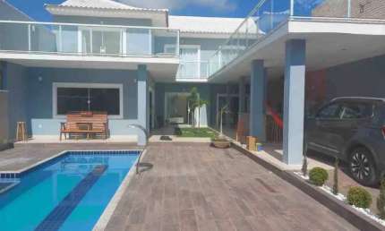 Casa espetacular mobiliada com piscina em Condomínio Fechado com 5 Suítes