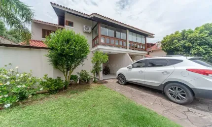 Casa em condomínio fechado com 3 quartos à venda na Avenida Eduardo Prado, --, Cavalhada, Porto Alegre por R$ 1.200.000