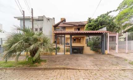 Casa com 4 quartos à venda na Rua Geminiano Candiota Xavier, 15, Espírito Santo, Porto Alegre por R$ 1.200.000