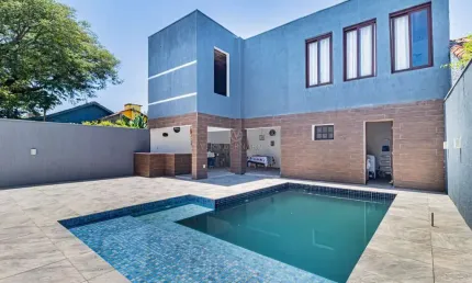 Casa com 4 quartos à venda na Rua Jacundá, --, Guarujá, Porto Alegre por R$ 1.500.000