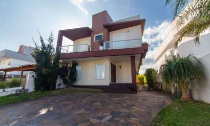 Casa em condomínio fechado com 3 quartos à venda na Avenida Edgar Pires de Castro, --, Aberta dos Morros, Porto Alegre por R$ 990.000