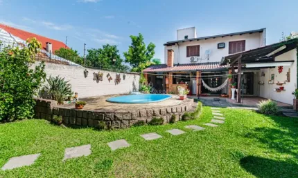 Casa com 3 quartos à venda na Avenida Guarujá, --, Guarujá, Porto Alegre por R$ 750.000