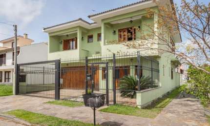 Casa em condomínio fechado com 3 quartos à venda na Rua Louro, 34, Hípica, Porto Alegre por R$ 650.000