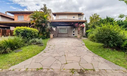Casa em condomínio fechado com 3 quartos à venda na Avenida Juca Batista, --, Belém Novo, Porto Alegre por R$ 1.370.000
