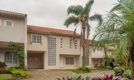 Casa em condomínio fechado com 4 quartos à venda na Rua Conrado Ferrari, 71, Jardim Isabel, Porto Alegre por R$ 950.000