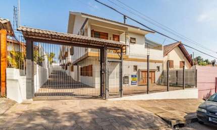 Casa em condomínio fechado com 3 quartos à venda na Rua Victor Silva, 515, Camaquã, Porto Alegre por R$ 680.000