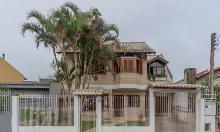 Casa com 4 quartos à venda na Avenida Guarujá, 115, Guarujá, Porto Alegre por R$ 850.000