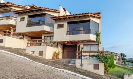 Casa em condomínio fechado com 3 quartos à venda na Rua Alcebíades Antônio dos Santos, --, Nonoai, Porto Alegre por R$ 895.000