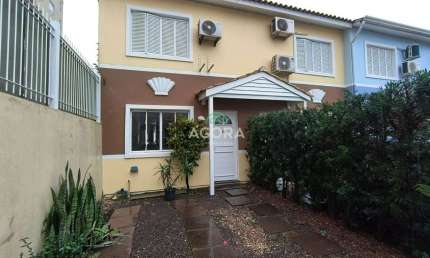 Casa em condomínio fechado com 3 quartos para alugar no Marechal Rondon, Canoas  por R$ 2.700