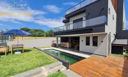 Estilo  rústica moderna, casa 4 dormitórios ,   condomínio alto padrão com sistema clube