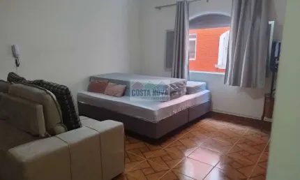 Apartamento a venda na Vila Tupi, a 50 metros da praia. 1 quarto, 1 banheiro, 1 garagem