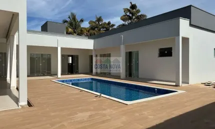 Casa de alto padrão com 4 suítes e lazer completo no condomínio campo alegre