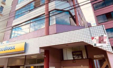 Vendo amplo apartamento com  2 quartos e garagem em cima da agência do Banco do Brasil e em frente a Locomotiva