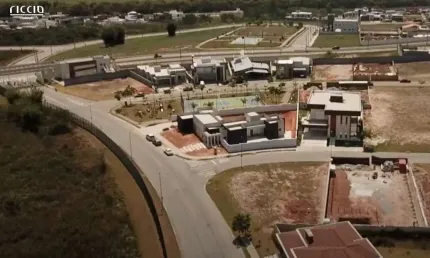 Terreno à venda de esquina - 662 m² no condomínio colinas do paratehy norte - terreno semi plano