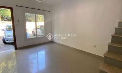 Casa em condomínio fechado com 3 quartos para alugar na Rua Júlio Dias de Souza, 175, Aberta dos Morros, Porto Alegre, 99 m2 por R$ 2.500