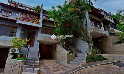 Casa em condomínio fechado com 4 quartos para alugar na Rua Landel de Moura, 1505, Tristeza, Porto Alegre, 340 m2 por R$ 4.900