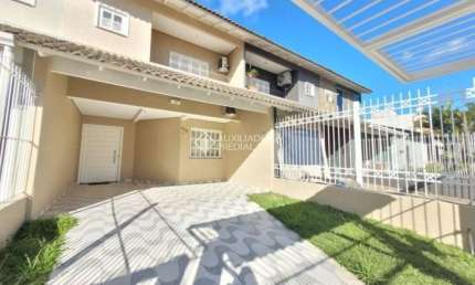 Casa em condomínio fechado com 3 quartos para alugar na Rua Pau Brasil, 626, Hípica, Porto Alegre, 122 m2 por R$ 3.500