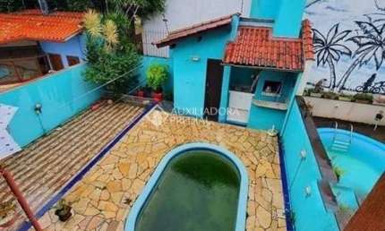Casa em condomínio fechado com 3 quartos para alugar na Avenida Eduardo Prado, 2050, Cavalhada, Porto Alegre, 397 m2 por R$ 3.950