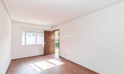 Casa em condomínio fechado com 2 quartos para alugar na Rua Santa Mônica, 404, Ponta Grossa, Porto Alegre, 60 m2 por R$ 1.200