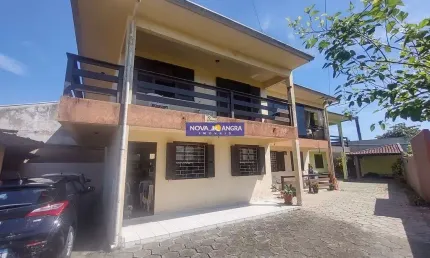 Sobrado a venda com 03 dormitórios sendo 01 suíte a duas quadras do mar