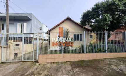 Página 1 Imóveis anuncia casa mista de 3 dormitórios com amplo terreno, para venda no bairro Nossa Senhora das Graças, Canoas/RS. - CA213