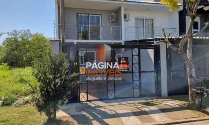 Página 1 Imóveis anuncia excelente sobrado para venda com 03 dormitórios, sendo 01 suíte, vaga para 02 carros no Loteamento Quinta do Palermo no Bairro Estância Velha, Canoas/RS. - SO92