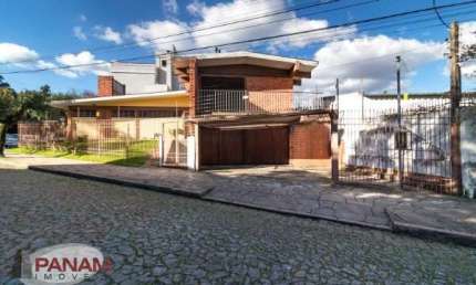 Casa com 3 quartos à venda na Rua Veronese, 297, São Sebastião, Porto Alegre por R$ 990.000