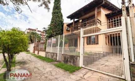 Casa com 4 quartos à venda na Rua Irmão Augusto, 139, Jardim Lindóia, Porto Alegre por R$ 1.290.000