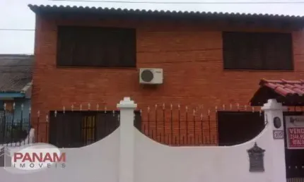 Casa com 4 quartos à venda na Rua Breno Arruda, 105, Santa Maria Goretti, Porto Alegre por R$ 649.000