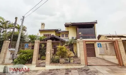 Casa com 4 quartos à venda na Travessa Porto Príncipe, 59, Jardim Lindóia, Porto Alegre por R$ 1.690.000