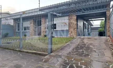 Casa com 3 quartos à venda na Rua Doutor Ney de Almeida Brito, 105, Jardim Lindóia, Porto Alegre por R$ 1.120.000