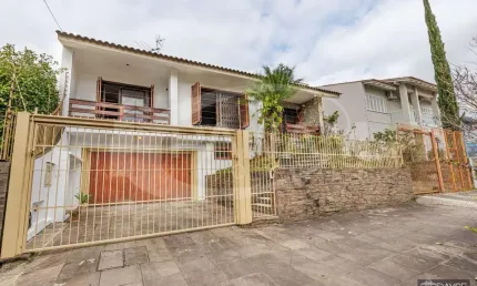 Casa com 3 quartos à venda na rua maestro salvador campanella, 70, jardim itu sabará, porto alegre por r$ 1.300.000