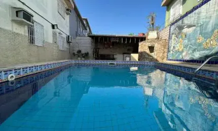 Casa sobreposta terrea 4 dormitórios à venda, 150 m² por R$ 1.100.000 - Macuco - Santos/SP