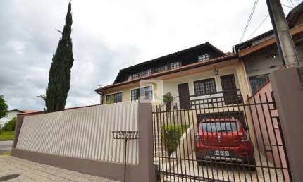 Casa com 3 quartos à venda na Alexandre Dalcuch, 156, Bacacheri, Curitiba por R$ 1.100.000