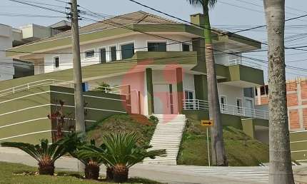 Sobrado em condomínio para venda com 04 quartos (5 suítes) e 08 vagas de garagem - 900m² no Jaguary