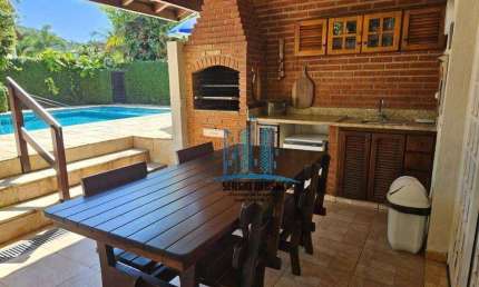 Casa à venda na Praia de Pernambuco - Guarujá-SP | Condomínio Jardim Pernambuco 1.  São 4 suítes, piscina privativa, churrasqueira. 6 vagas de garagem