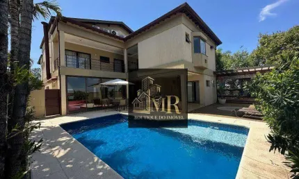 Alphaville Campinas  - Casa de esquina com 5 dormitórios sendo 3 suítes com terraço, escritório e amplas salas.   522.7 m² Área Construída 635.38 m²
