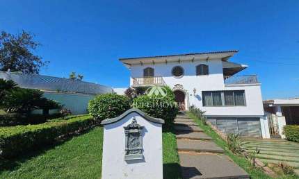 Casa de Alto Padrão Residencial/Comercial localizada no Bairro Ribeirânia, terreno de 1703m² e 862,73m² de área construída, 6 suítes.