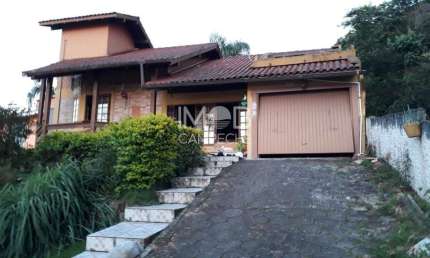 Casa com 3 quartos à venda na Rodovia Baldicero Filomeno, 13657, Ribeirão da Ilha, Florianópolis por R$ 1.800.000