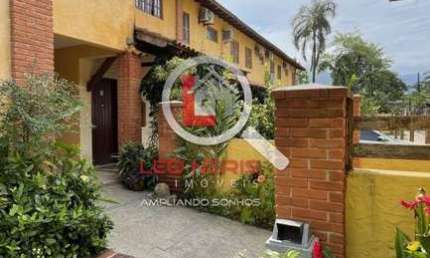 Casa em Condomínio Fechado à Venda em Camburizinho - 2 Dormitórios, Suíte, Garagem e Lazer!