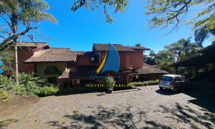 Casa à venda em costeira na Ilhabela-SP, bairro Ponta das Canas: 5 quartos, 5 suítes, 3 salas, 8 banheiros, pier para embarcação até 75 pés, 2 poitas.