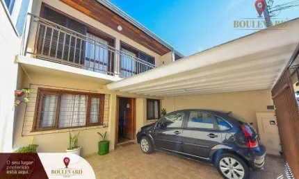 Sobrado de frente para a rua, com 3 dormitórios à venda, 110 m² por R$ 550.000 - Uberaba - Curitiba/PR