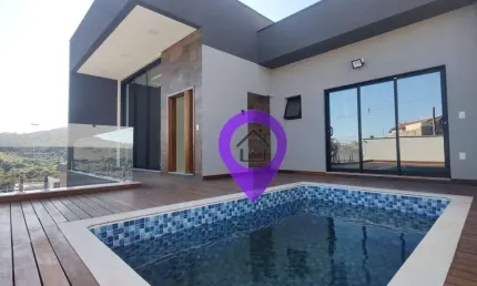 Casa de 220m² à venda em Pouso Alegre com 3 suítes, piscina e área gourmet. Excelente localização a 10min do centro. 4 vagas de garagem