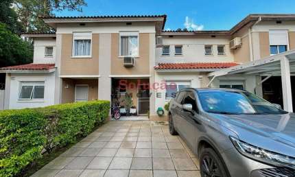Casa em condomínio fechado com 3 quartos à venda no Marechal Rondon, Canoas  por R$ 949.000
