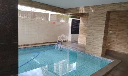 apartamento a venda na praia grande, bairro caiçara, repasse de financiamento com 2 quaros, 2 suites e 1 vaga