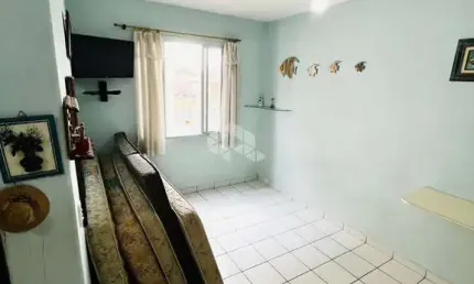 Kitnet com 01 dormitório/sala, cozinha,banheiro,vaga de garagem e próximo da praia.