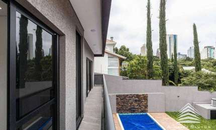 Casa a venda no Ecoville, 3 suítes, 4 vagas de garagem, com piscina aquecida e espaço gourmet com churrasqueira