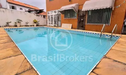 Casa jardim guanabara com piscina e área de lazer, com cinco quartos,sendo três suites.