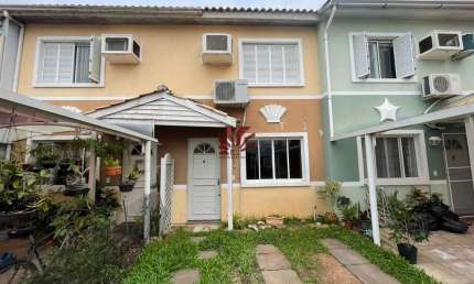 Casa em condomínio fechado com 3 quartos à venda na Avenida Santos Ferreira, 1180, Marechal Rondon, Canoas por R$ 399.000